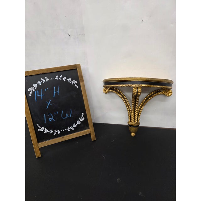 Add timeless elegance to your interiors with this vintage neoclassical giltwood wall shelf, featuring refined detailing...