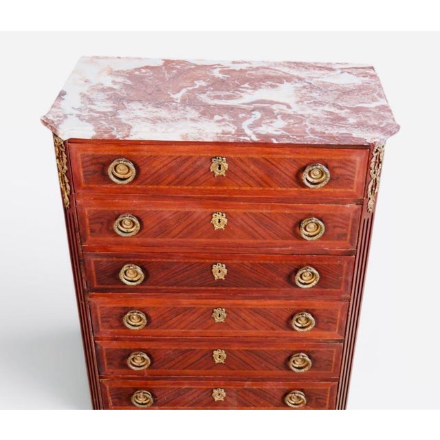 Pair of 19th Century French Louis XVI Gilt-Bronze & Parquetry Marble-Top Semainiers An elegant and unusually decorative...