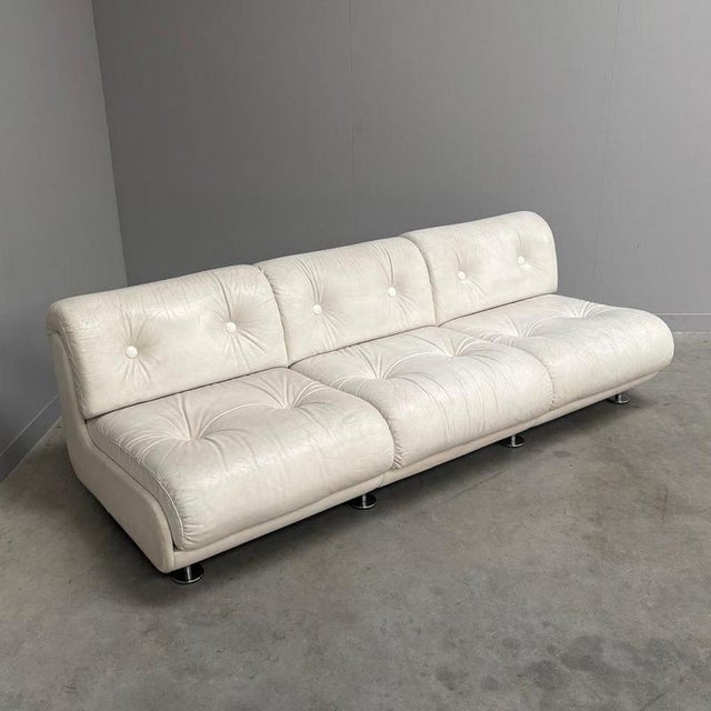 Remarks: Vintage Space Age lounge sofa, Germany 1970s. Wooden frame and upholstered with white leather. Sofa is in very...