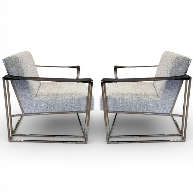 A pair of Industrial Modern Dekker sling-arm lounge chairs by Bernhardt. Features a sleek, polished stainless steel frame,...