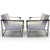 A pair of Industrial Modern Dekker sling-arm lounge chairs by Bernhardt. Features a sleek, polished stainless steel frame,...