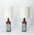 An elegant pair of scandinavian table lamps in solid teak, adorned with a central mosaic band of small glazed ceramic...