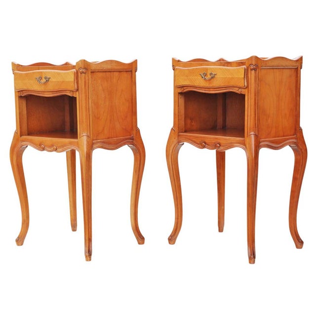 Pair of Vintage Mid-Century Cherry or Walnut Bedside Tables – Circa 1950 This pair of vintage mid-century bedside tables,...