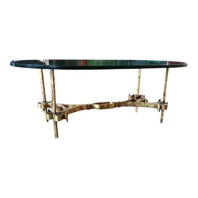 Spanish gothic brutalist wrought-iron gilded iron based coffee table, with extremely heavy and thick 3/4” elliptical top...