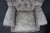 Pair of Leathercraft Inc. tufted leather recliner club chairs upholstered in distressed gray leather. Each chair features...