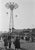 Coney Island Parachute Jump Fairground stalls in Coney Island, New York City, with the Parachute Jump behind, circa 1952....