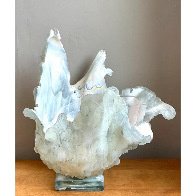 This vintage abstract glass art vase presents a dramatic, sculptural silhouette that seems caught mid-motion, with...