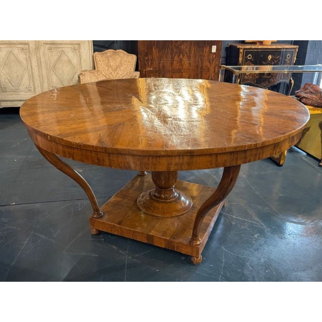 The 19th Century Italian Center Table is a stylish and elegant piece of furniture that adds a touch of sophistication to...