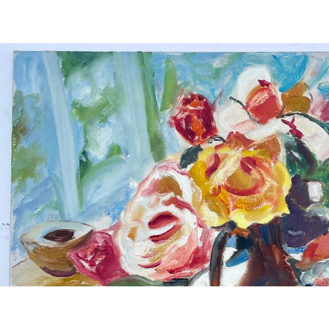 This is a beautiful abstract still life of yellow, white, and pink garden-picked roses surrounded by hues of blue,...