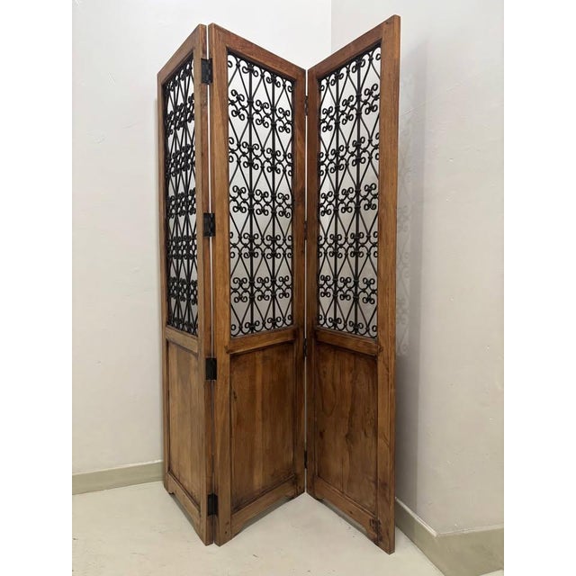 1980's Spanish Mission Style Room Divider, Wood Frame and Wrought Iron Screen. 3 panels that measure 70" H x 19"W. Total...