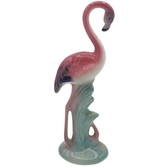 Mid-century pink and green ceramic flamingo tabletop statue by Brad Keeler. It features a beautifully detailed pink...