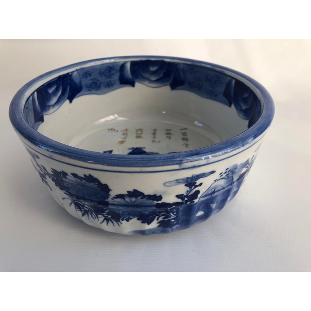 Large Chinese fine porcelain bowl exquisitely decorated in graduations of vibrant blue to pale blue tones depicting...