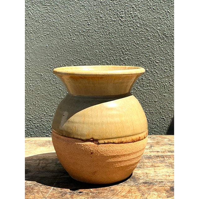 This vintage studio pottery vase is a beautiful study in contrasts, perfectly embodying the Wabi-Sabi philosophy of...