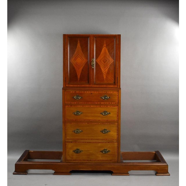 A fine quality Edwardian mahogany triple wardrobe, offering generous storage and elegant proportions. Crafted in richly...