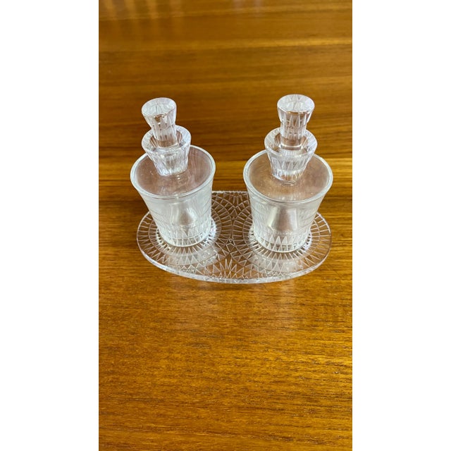 Vintage LALIQUE FRANCE BOURGUEIL Oil and vinegar bottles with a holding tray. Dimensions are with the bottles and stand...