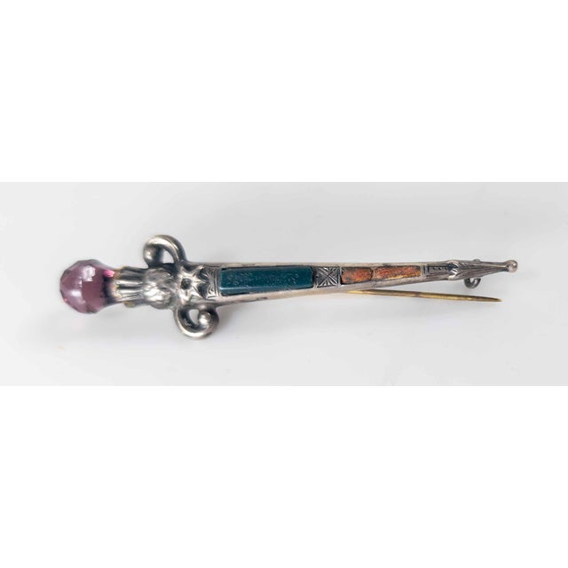 We are selling this Scottish Sterling Silver Dirk brooch pin. This Scottish dirk is made from sterling silver with green...