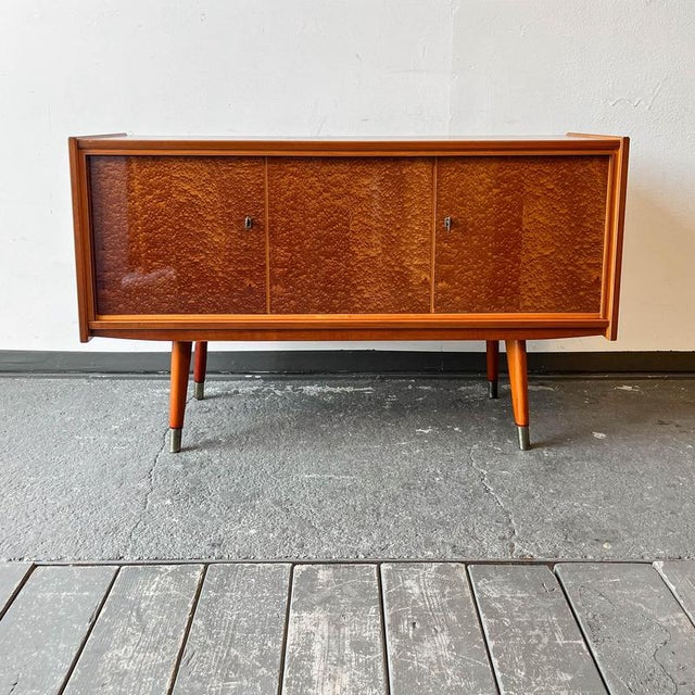 Product. Sideboard style. Mid-century · 1960s manufacturer. Franz widynski · möbelfabrik material. Veneered in makore...