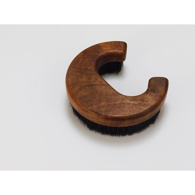 A beautiful modernist clothes or coat brush in the shape of the letter c from the 1960s. Designed and executed by carl...