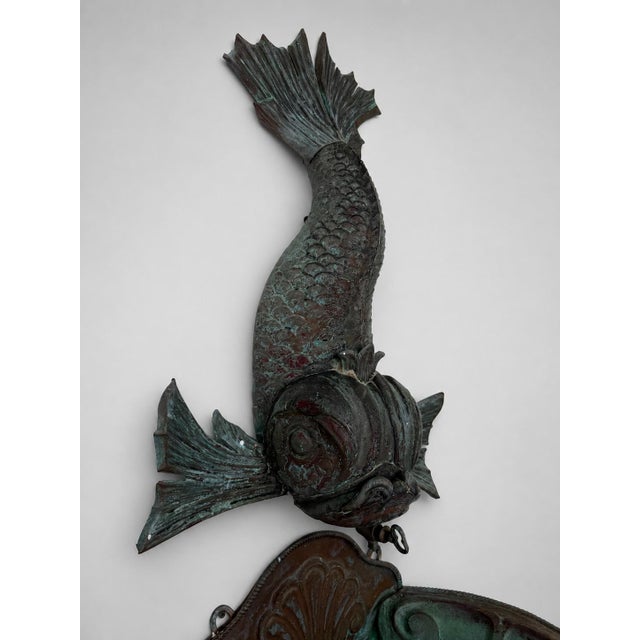 A rare and highly decorative Italian verdigris copper lavabo, late 19th to early 20th century, modeled as a dramatic...