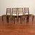 Set of four vintage ladderback dining chairs made in the U.K. by G-Plan circa early 1970's. Featuring afromosia (African...