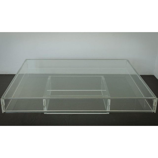1970s large modernist glass top and acrylic glass sides coffee table. Approx. Date: 1970s. Table size: h 35 cm x w 89.5 cm...