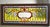 Victorian style stained glass window with clear beveled glass rondels against a classic yellow teardrop background....