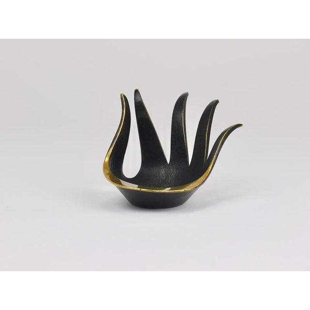 A beautiful mid-century sculptural brass bowl designed in the shape of a hand. Originally conceived as an ashtray, this...