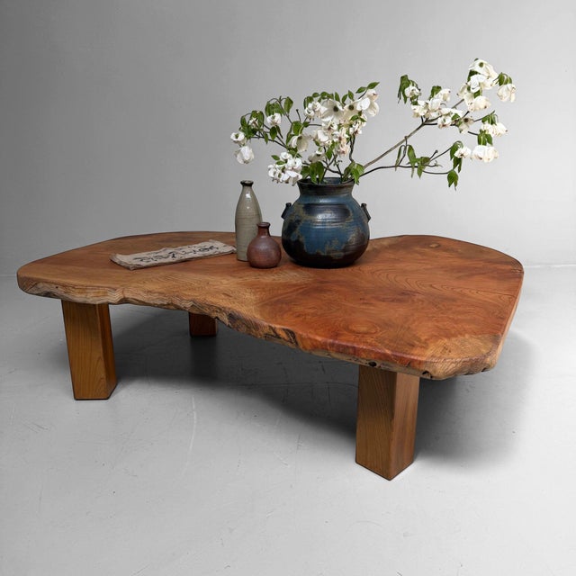 Exceptional low Japanese table from the 1960s, made with a solid keyaki wood slab cut from a single piece. The tabletop...