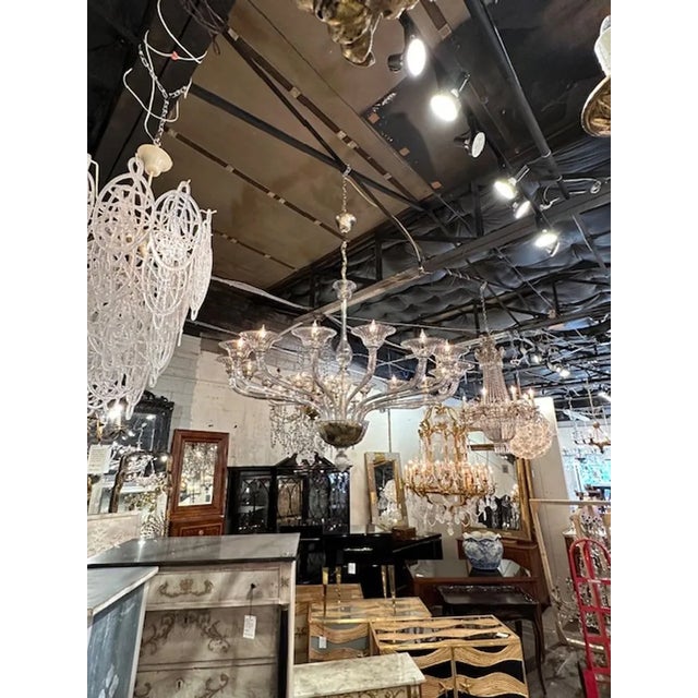 Gorgeous large scale Murano smoke glass 16 light chandelier. Circa 2000. The chandelier has been professionally rewired,...