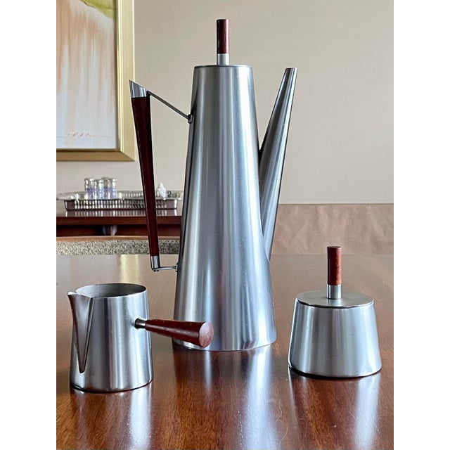 Outstanding Mid-Century Modern Italian made stainless steel three-piece tea or coffee service including a sculptural...