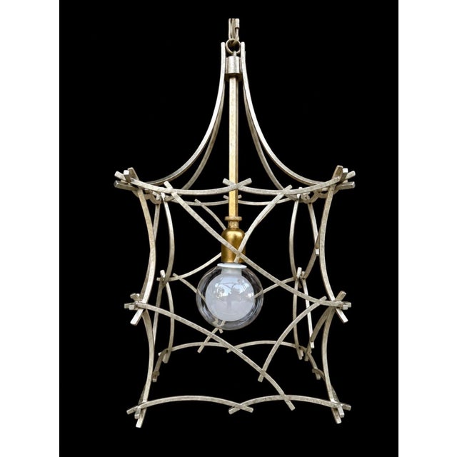 Vintage fixture in the shape of a pagoda lantern. There is both silver and gold colors in this piece so it can blend...