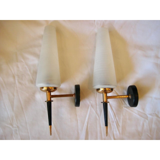 Strong in style those 2 sconces have the perfect shape and size to be placed in any room , they are elegant by the...