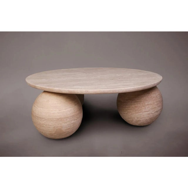 Expertly carved and hand-finished from solid blocks of vein-cut travertine, each piece exhibits the inherent variations in...