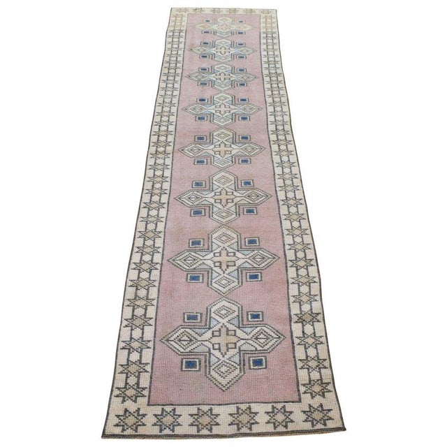 Hand-knotted with care using traditional rug-making techniques, this wool rug blends timeless craftsmanship with a modern...