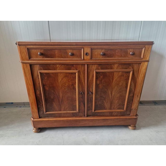 Biedermeier-style cabinet. Mahogany. In France. 1860s. Height 100cm; width 120cm; depth 52cm