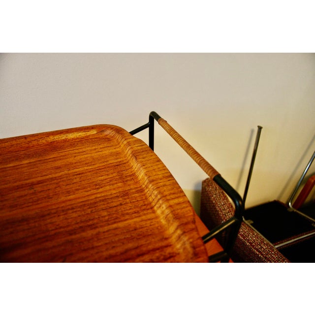 Teak and metal side table by Silva Sweden in good condition, with a very small chip on one of the handles. This piece has...