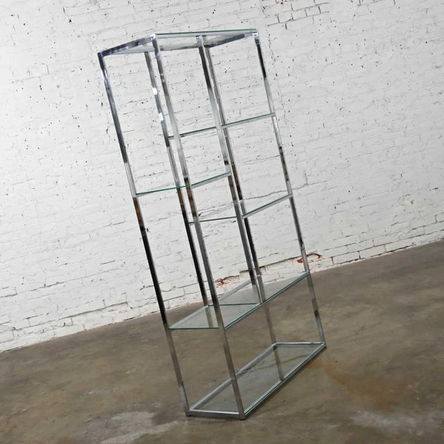 Lovely mid-century modern chrome etagere with 6 glass shelves with Piet Mondrian shelf placement. Beautiful condition,...