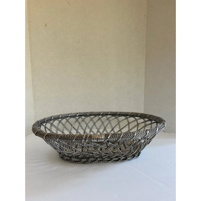Large twisted silver metal basket. Perfect to serve rolls and bread at the holidays or to make an arrangement in. COMBINED...