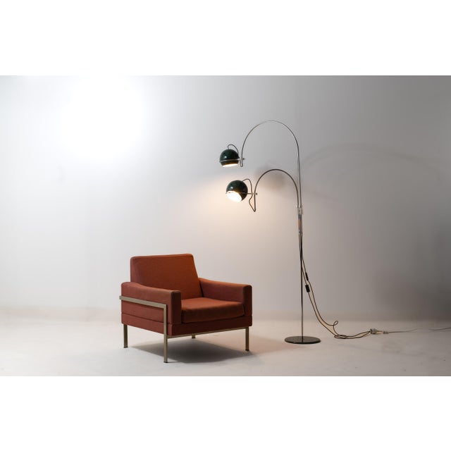Striking mid-century “eyeball” floor lamp by GEPO. Both swing arms are adjustable in heights and position. The metal lamp...