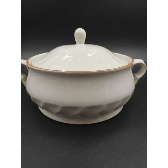 Vintage Hearthside Sculptura Stoneware Lidded Casserole Dish. Off-white/ivory with gold trim and swirl design. Made in...