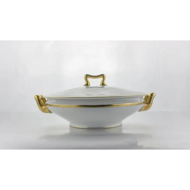 White porcelain serving dish with gilt border and handles signed Paul Muller Selb, Bavaria, circa 1917.