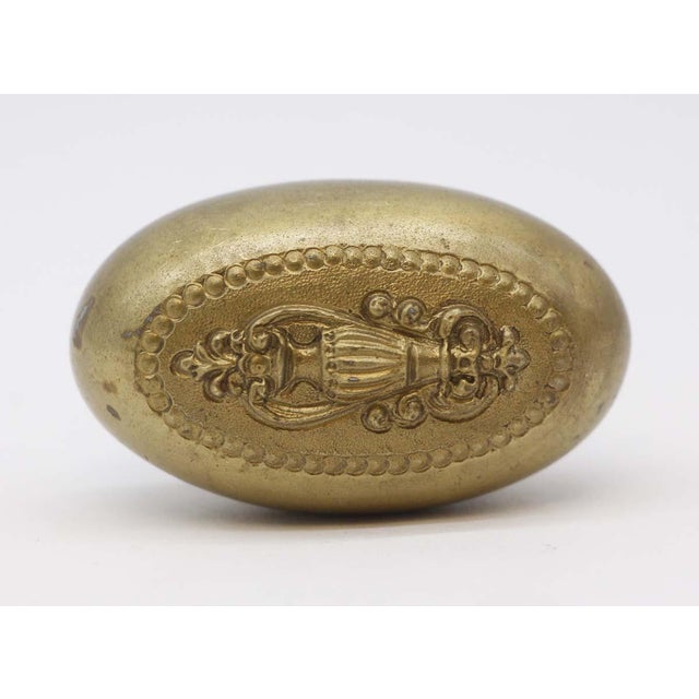 This Colonial style oval door knob was made by Russell & Erwin in the 1887 catalog. It is part of the N-17100 Priscilla...
