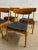 A superb set of 4 Danish teak back dining chairs in excellent original condition. Featuring a sleek black upholstery these...