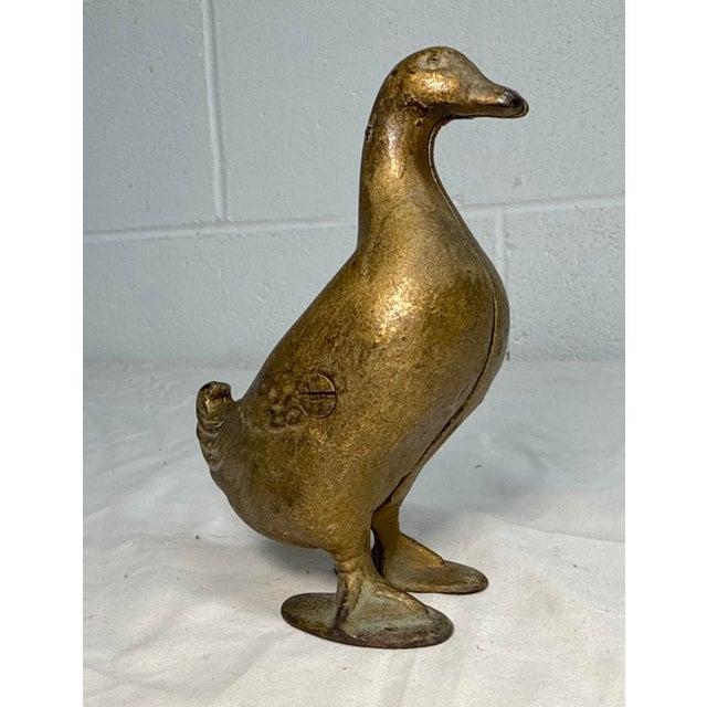 Up for sale is an antique early 1900's AC Williams hand-painted cast iron gold duck still bank. This collectible bank is...