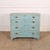 Late 18th century English four drawer pine and oak chest of drawers with later mottled blue paint. 1790. This piece is...