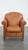 Offered this beautiful and comfortable cowhide leather armchair/ armchair in a warm cognac color finished with decorative...