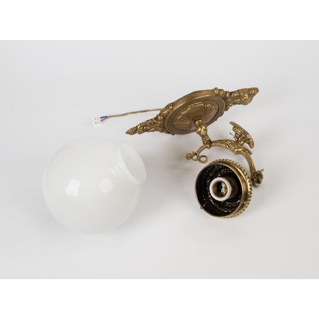 1960s Spanish Gothic Gold Brass Winged Griffin Wall Sconce With Opaline Glass Globe For Sale - Image 6 of 8