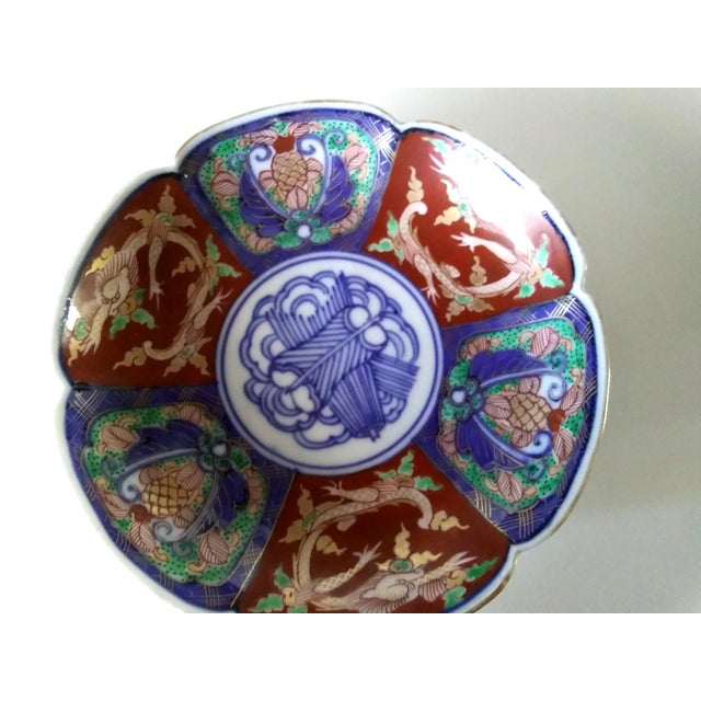 Beautifully painted Japanese porcelain plate....4 3/4" diameter, 1" high. Exquisite craftsmanship.