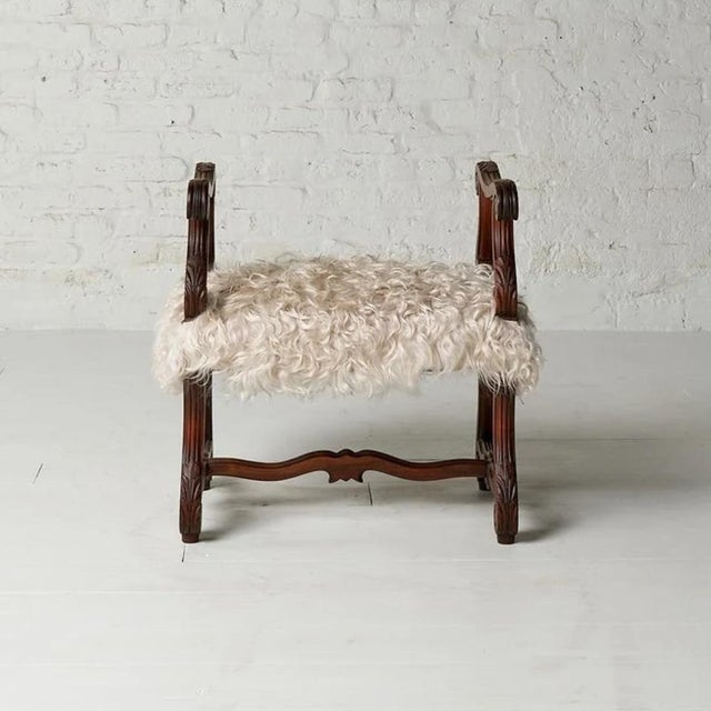 This antique 1900s French wood and upholstered stool is a charming blend of rustic elegance and timeless European...