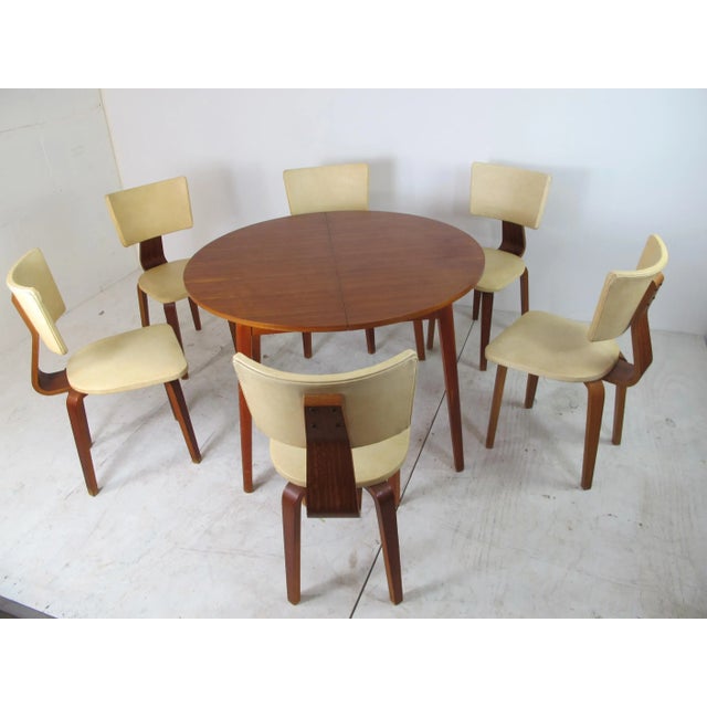 Modernist, Mid-Century Plywood Dining 6 Chairs and an extendable table by Cor Alons for Gouda den Boer, 1960s, in original...